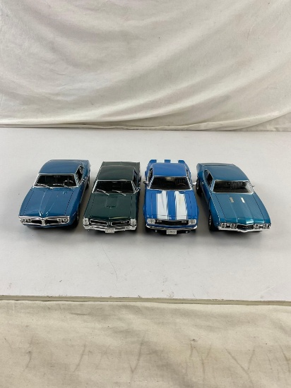 Collection of 4 Die Cast Metal Replica Muscle Cars in 1/24 Scale incl. 65' GTO, 68' Camaro z28..