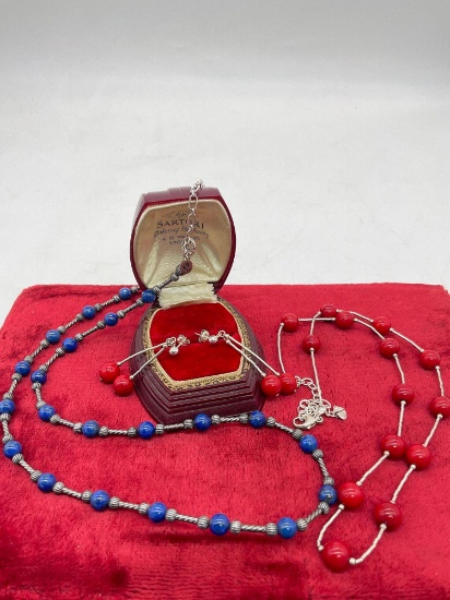 Pair of sterling silver red and blue stone bead necklaces, one with matching earring pair