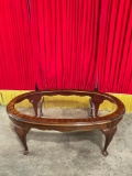 Vintage Oval Glass Topped Wooden Coffee Table w/ Cabriolet Legs. Measures 45