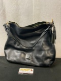 Dooney & Bourke Genuine Leather Purse, Black Leather w/ a Red lining