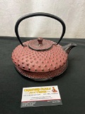 Lovely Cast Iron Teapot w/ Matching Trivet, pale red with a stippled texture