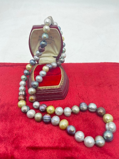 Graduating size large and colorful cultured pearl necklace with sterling silver clasp