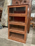 Vintage Wooden Barrister Bookcase w/ 4 Shelves & Folding Glass Fronts. Measures 34