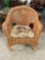 Vintage Woven Rattan Trellis Back Patio Armchair w/ Floral Cushion. Measures 31