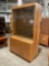 Vintage 2 Piece Locking Glass Fronted Illuminated Display Case w/ 8 Glass Shelves & Cupboard. See