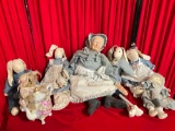 7 pcs Vintage Dolls. 4 Cloth Rabbit Dolls, 1 Porcelain? Grandma, 1 Bear w/ Teapot. See pics.