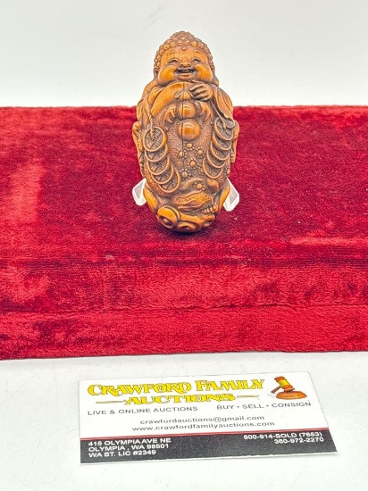 Finely Detailed Carved Asian wood carving of a child clutching the mythical Money Toad W/ coins