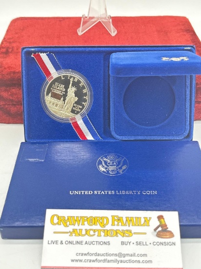 1986 US Mint Ellis Island Silver Proof Commemorative Dollar in display case