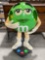 Green M&M Candy Plastic Store Rolling Display Stand. Very Good Condition. See pics.