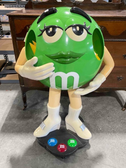 Green M&M Candy Plastic Store Rolling Display Stand. Very Good Condition. See pics.