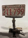 Vintage Oregon License Plate 1948 on Cast Iron Clamp, possibly old vehicle accessory
