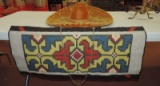 Sombrero and Needlework Tapestry