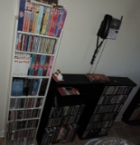 (3) Shelves of CD's and Dvd's