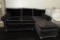 Kenore Saint Black Upholstered Sofa with a Chaise End