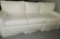 Three Cushioned Slip Covered Sofa