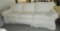 Three Cushioned Slip Covered Sofa