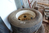 USED 295/75R22.5 TIRE MOUNTED ON STEEL RIM