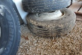 USED 295/75R22.5 TIRE MOUNTED ON STEEL RIM