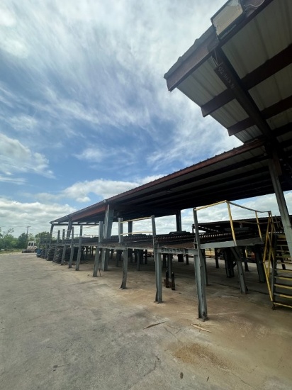 28ft X 90ft Steel Canopy Covering Tie Sorter System, Canopy Frame Is Red Iron And Bolted To Concrete