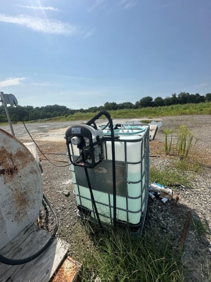 Piusi Filtering Fluid Pump (115 Volt) with Plastic of DEF Fluid, Approx 40% Full. Located at 3360 Ca