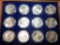 LOT OF 12 1 OZ SILVER ROUNDS IN DISPLAY