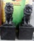 PAIR OF BLACK CEMENT LIONS WITH PEDESTALS