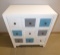 NEW WHITE COMMODE WITH COLORED DRAWERS