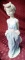 LLADRO GIRL WITH FLOWERS IN POCKETS & HAT BEHIND BACK