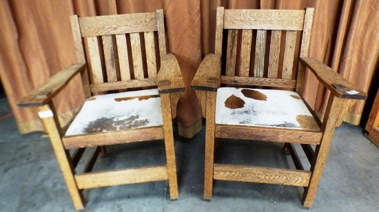 PAIR OF OAK MISSION ARM CHAIRS WITH COW HIDE SEATS