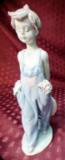 LLADRO GIRL WITH FLOWERS IN POCKETS & HAT BEHIND BACK