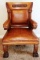 ANTIQUE LEATHER & OAK ORNATE ARM CHAIR