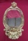 ORNATE CHERUB GOLD OVAL FRAMED MIRROR