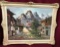 1960'S SIGNED FRAMED CANVAS ARTWORK - VILLAGE & MOUNTAINS