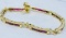 18KT YELLOW GOLD RUBY AND DIAMOND BRACELET