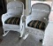 LOT OF TWO WHITE RATTAN PATIO ROCKERS