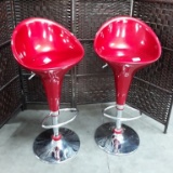 PAIR OF HYDRAULIC RED BARSTOOLS