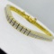 18KT YELLOW GOLD 10.20CTS DIAMOND BRACELET FEATURES PRINCESS CUT INVISIBLE SET DIAMONDS