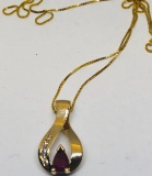 14KT YELLOW GOLD RUBY AND DIAMOND PENDANT WITH CHAIN