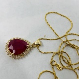 14KT YELLOW GOLD 7.22CTS RUBY AND .30CTS DIAMOND PENDANT WITH CHAIN