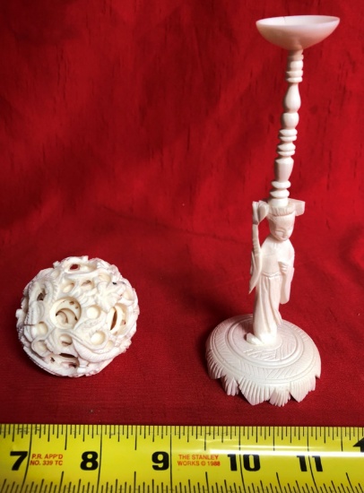 HEAVILY CARVED BONE PUZZLE BALL AND CANDLE STAND