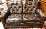 BROWN LEATHER VERY TUFTED CHAIR