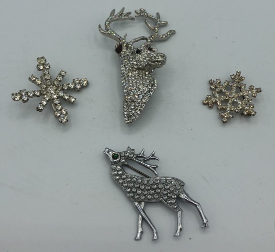 2 Rhinestone Stag Brooches; 2 Snowflake Brooches