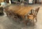 6 Nichols & Stone Oak Chairs (2 Arm & 4 Side);     Farm Style Table W/ Draw