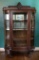 Oak Curved Glass China Cabinet W/ Massive Paw Feet & Carved Face Crown - Ci