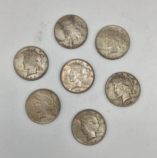 7 Peace Dollars: 1922-S, 1922-D, 1922-No Mint Mark, 2 1923-D, 2 1923-No Min