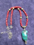 Red Beaded Necklace with Polished Pendant