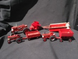Collection of 7 Miniature Farmall Tractor Toys