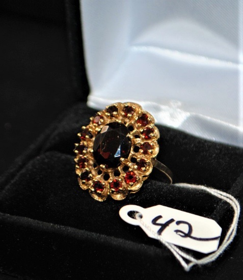 ONE HALLMARKED AND TESTED 10K YELLOW GOLD  LADIES GARNET RING CONSISTING OF