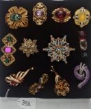 12 VINTAGE BROOCHES