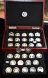 32 MIXED $1 SILVER COMMEMORATIVE COINS IN BOX